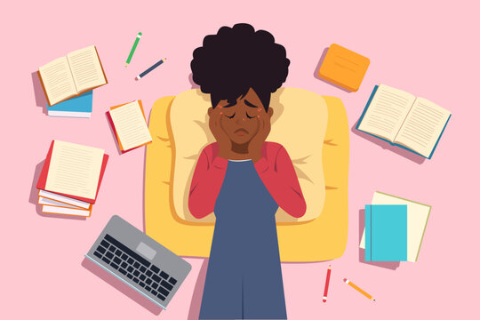 Top view of a black teenage girl feeling stress and pressure studying for high school or a college exam. A tired African American student having difficulties with learning her home work assignment