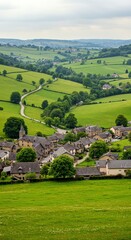 Naklejka premium Village in Green Rolling Countryside Landscape