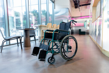 Picture of a wheelchair in the middle of the room