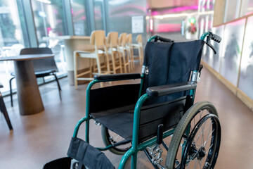 Picture of a wheelchair in the middle of the room