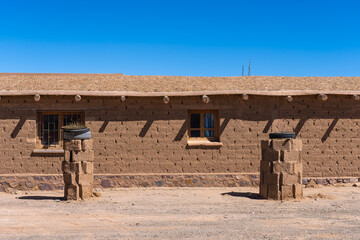 Traditional adobe house under clear blue sky in Argentina