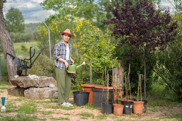 Sustainable gardening with an asian woman in nature