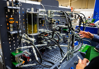 Complex hydraulic system demonstration unit with components like valves, sensors, gauges, and...