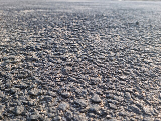 This is a close-up of an asphalt road.
