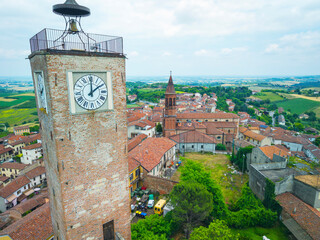 View of the medieval clock tower of Lu Monferrato, a small village, in the hilly winery area of Monferrato (Northern Italy, Piedmont Region), famous for its valuable wines and UNESCO site since 2014.