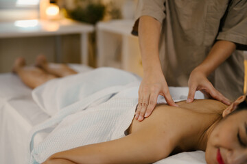 Closeup relaxed lady enjoy body massage at spa with closed eyes. Wellness concept.
