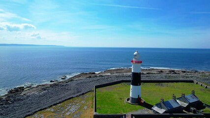 Drone flying past lighthouse Inisheer Aran Islands Ireland wild Atlantic way