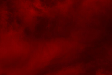 Red cloud texture background. Blurred photo of red sky with clouds. Photo can be used for galaxy space, New Year, Christmas and all celebrations backgrounds.