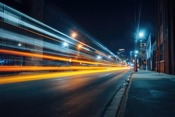 Naklejka premium City street at night with motion blur of car lights