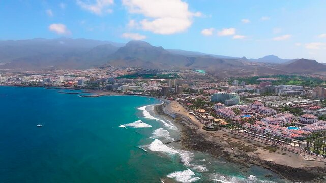 Troya beach, blue ocean and mountains in the canary islands, aerial view