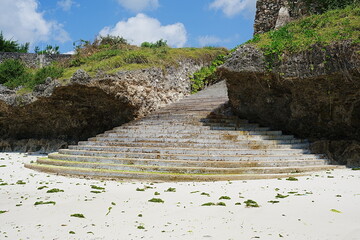Stony stairs and rocks at jambiani beach on Indian Ocean in African Zanzibar island in Tanzania