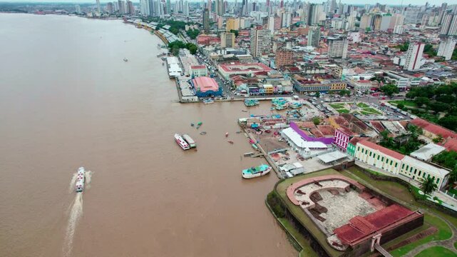 Boats and buildings line bustling waterfront of Bel&eacute;m, Brazil, aerial