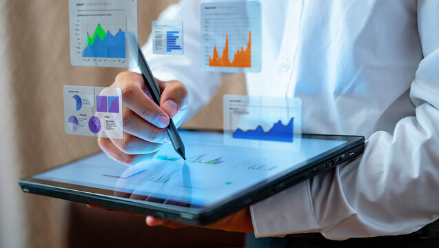 Business Analyst Using Digital Tablet to Analyze Financial Data