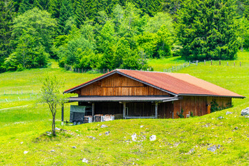 Obraz premium Alpine mountain hill landscape panorama with huts hut Tyrol Austria.