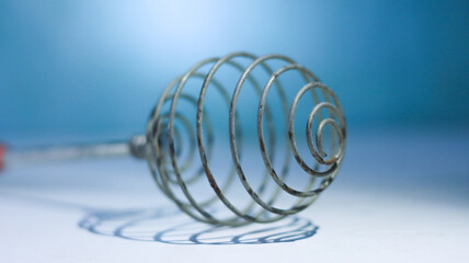 blue spiral string on white background