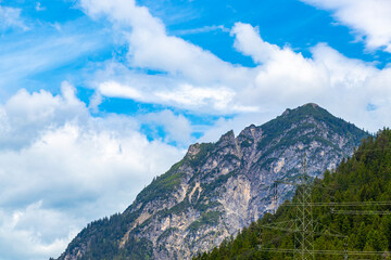 Alpine mountain range and hill landscape panorama view Tyrol Austria.
