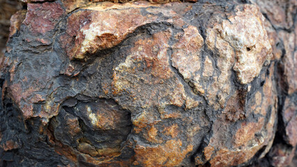 Close-Up of Weathered Red Granite Rock Texture