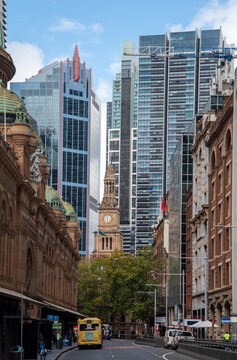 Clarence Street in Sydney with Town Hall clock tower and glass buildings behind