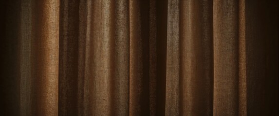 Fototapeta premium Brown fabric curtains with soft folds and texture in dim lighting, creating a warm and elegant atmosphere