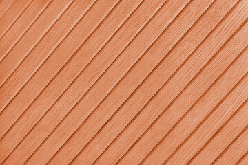Wooden diagonal plank, bamboo surface texture, board wall background. Painted wooden panels orange color, wallpaper, backdrop, design element.