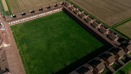 Aerial view of the Certosa di Pavia, built in the late fourteenth century, courts and the cloister of the monastery and shrine in the province of Pavia, Lombardia, Italy