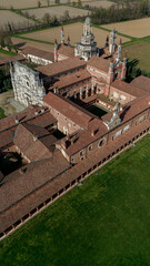Aerial view of the Certosa di Pavia, built in the late fourteenth century, courts and the cloister of the monastery and shrine in the province of Pavia, Lombardia, Italy