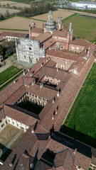 Aerial view of the Certosa di Pavia, built in the late fourteenth century, courts and the cloister of the monastery and shrine in the province of Pavia, Lombardia, Italy