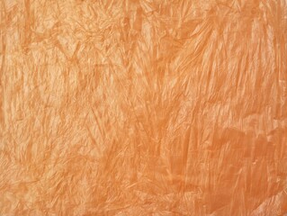 Abstrack orange crumpled plastic bag texture background