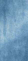 A textured surface in varying shades of blue, resembling denim fabric or a woven pattern, creating a visually intriguing design.