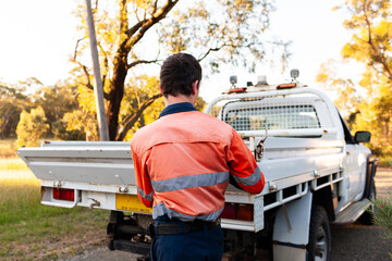 young Australian teenaged apprentice closing back of his ute tray