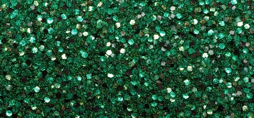 A shimmering green glitter texture featuring a mix of vibrant shades and reflective sequins, ideal for crafts and decorative projects.