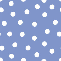 hand drawn white polka dot pattern on blue background. Seamless vector design element.
