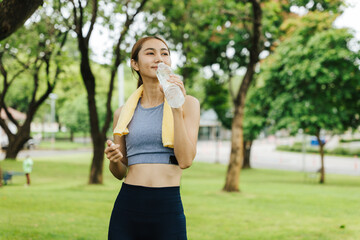 Fitness enthusiast cooling down after workout park photo greenery close-up health and wellness