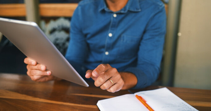 Remote work, man or hands with tablet at restaurant for research, editor feedback or proofreading. Notebook, writer and digital app at cafe for story development, creative process and editing blog