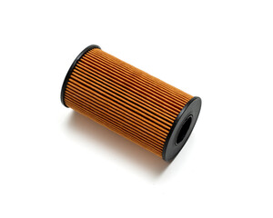 Car oil filter isolated on a white background, suitable for automotive, mechanical and technical photography.