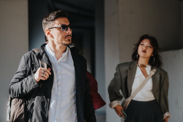 A diverse group of people engage in a discussion about market growth, analyzing sales data and brainstorming strategies for success in a modern city environment.