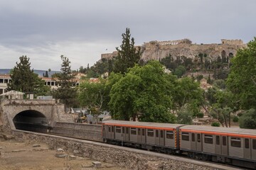 Subway Train Passing by the Ancient Acropolis in Athens, Greece