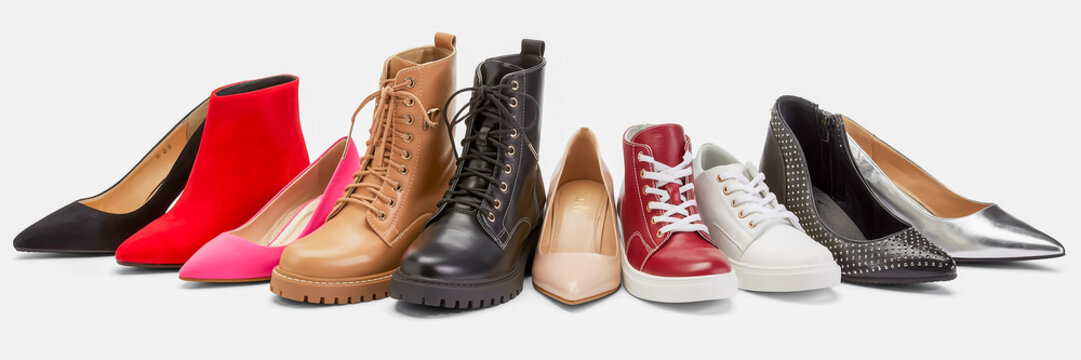 A clean commercial image of various women’s shoes in a row on white, softly lit to reveal texture, color, and detail