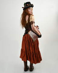 Full length walking portrait Steampunk Botanist, mad scientist, female model in Victorian Costume...