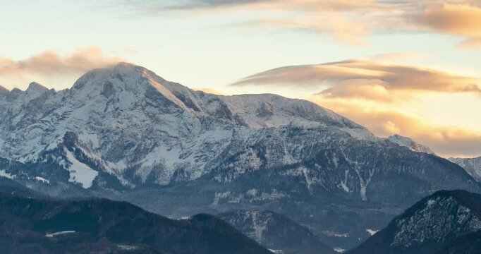 Salzburg, Austria - December 21, 2024: Mountain panorama at sunset viewed from Richterh&ouml;he in Salzburg. Timelapse, zoom out transition.