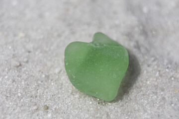 Light Green Heart Shaped Sea Glass on Sand