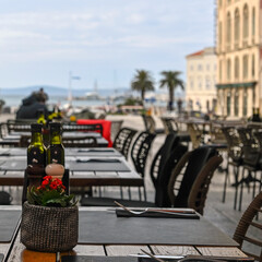 Outside restaurant table in Split, Croatia, with view of the sea