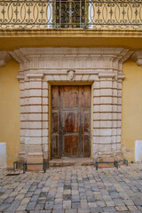 Grand Historic Entrance of a Palace in Ciutadella de Menorca. Traditional architecture, ornate stone portal, wooden door, Mediterranean island, cultural heritage