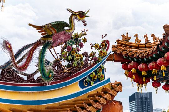Bright phoenix and temple rooftop detail