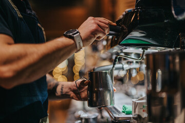 A barista operates a coffee machine to steam milk, creating a cozy cafe atmosphere. The image captures the process of crafting coffee drinks, evoking warmth, hospitality, and craftsmanship.