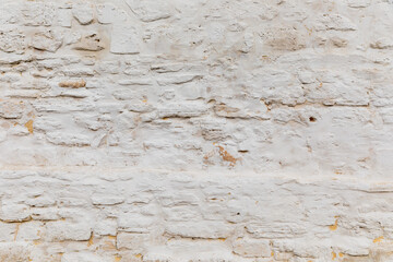 white rustic sandstone rendered wall