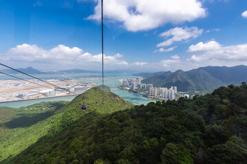 Lantau Island, Hong Kong, 10-20-2024 Views over Lantau Island seen from the cable car which connects downtown Tung Chung and Ngong Ping with the statue of the biggest buddha and the Po Lin Monastery