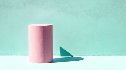 Pastel pink cylinder podium on mint backdrop