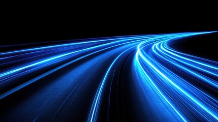 Blue light trails on a winding road