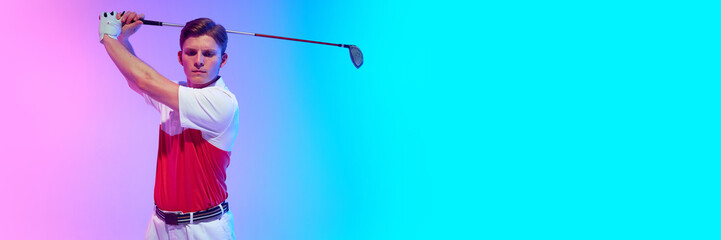 Banner. Golfer posing in final stance of dynamic swing with calm face and extended arms under neon light against gradient background with negative space. Concept of golf, sport, success